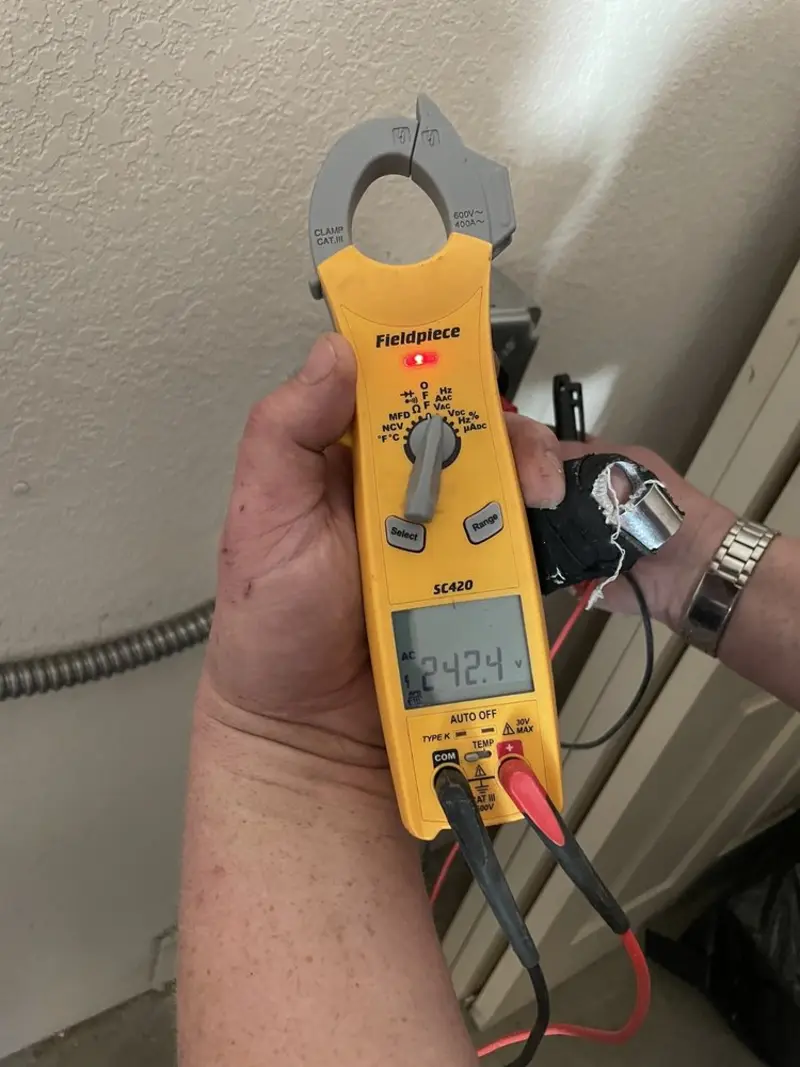 Voltage testing with clamp meter during Generator Installation in Rochester